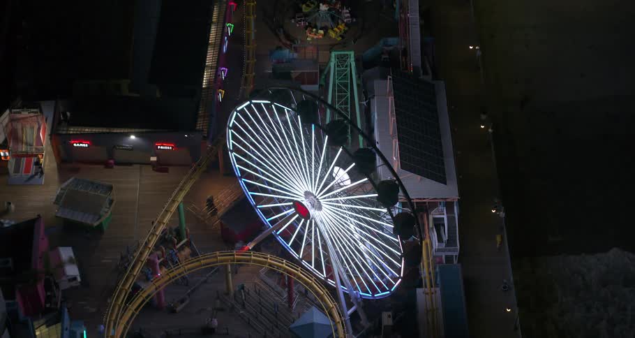 Empty Santa Monica Pier with lit up Ferris Wheel during COVID Lockdown 2020