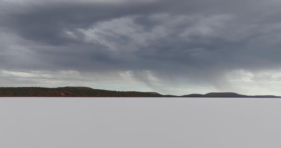Dark rain clouds hovering over the ocean