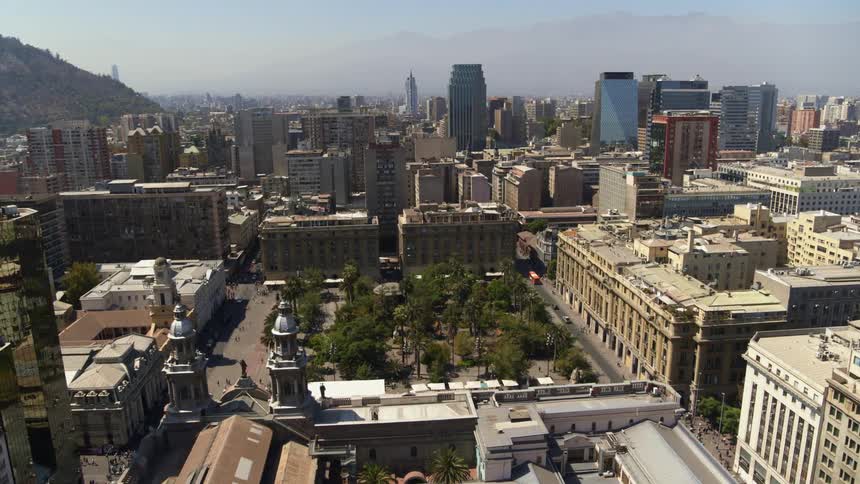 Plaza De Armas with dense city behind