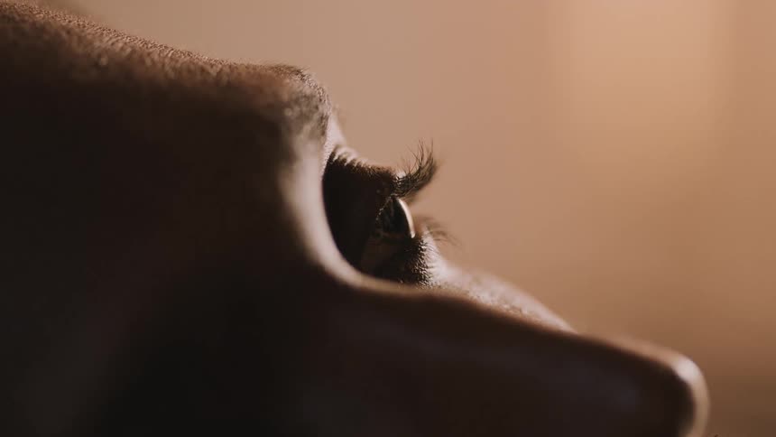 A person blinks their eye