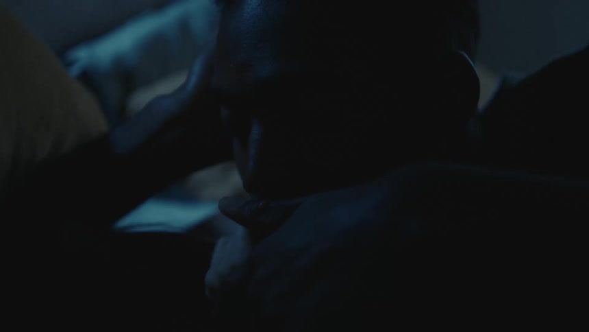 A man watches his partner sleep
