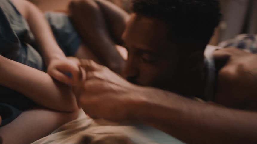 Time lapse of a happy couple playing with each other in bed