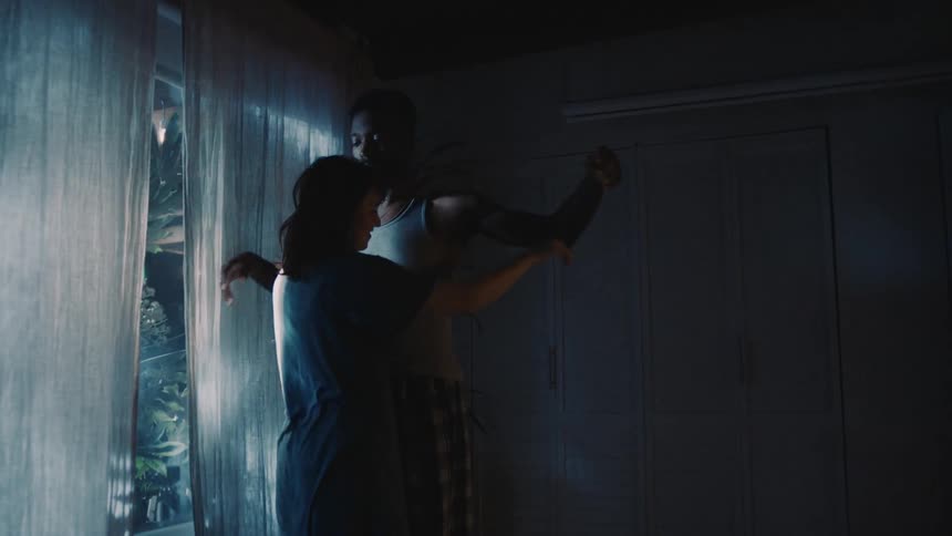 A woman walks up to hug her boyfriend