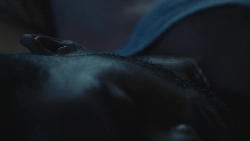 Man wearing undershirt lies on his back sleeping