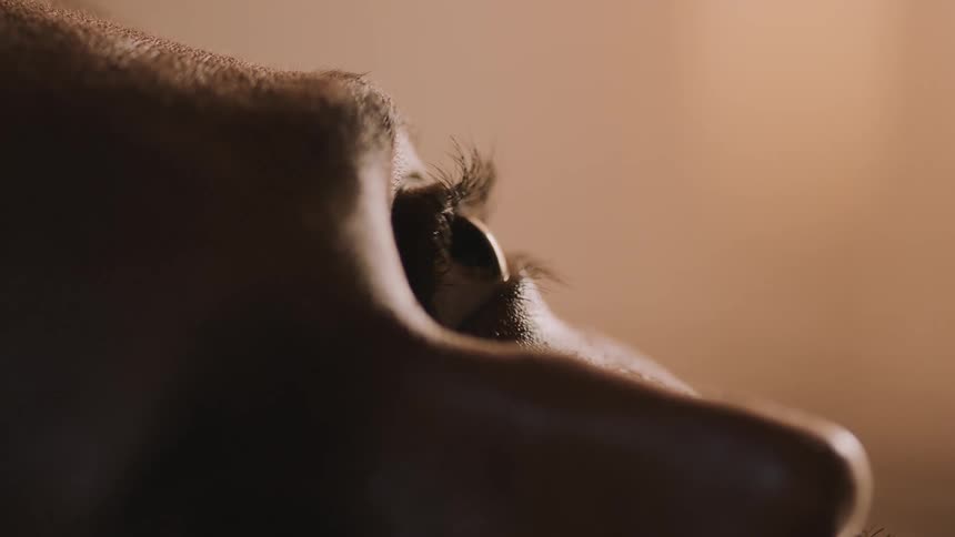 A person opens their eye