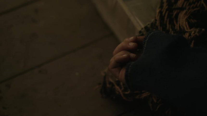 A persons hand is closed shut