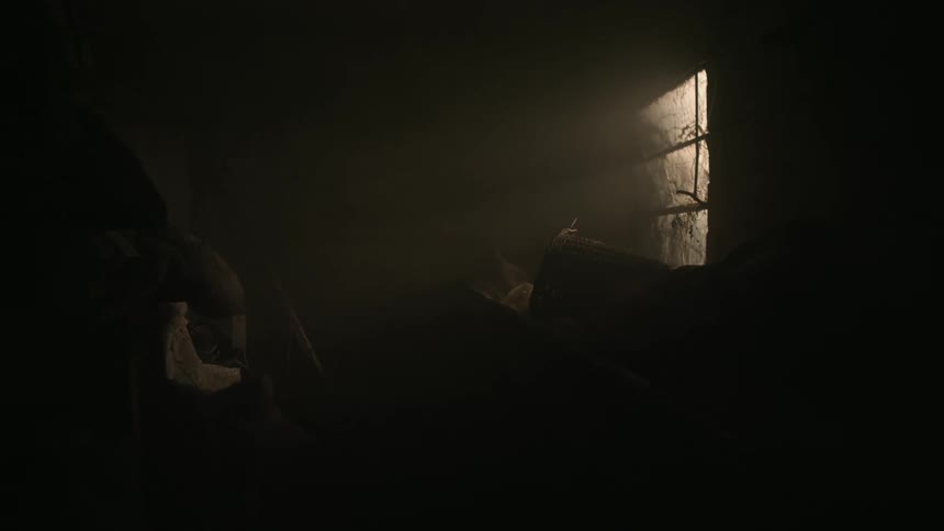 Light streams in through a window into darkness