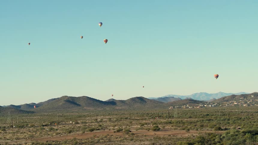 Balloons float over Arizona Desert