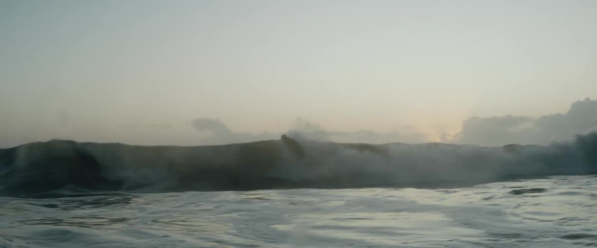 A surfer is riding a wave in the ocean
