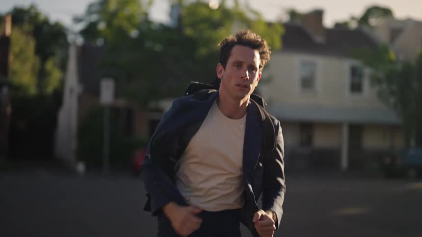 A man is running through town