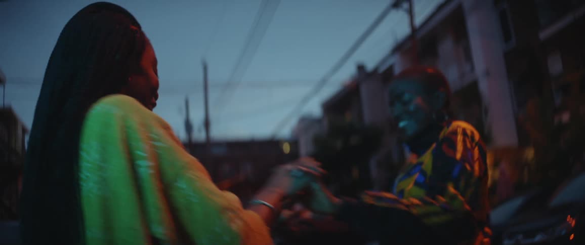 Two women are dancing outside