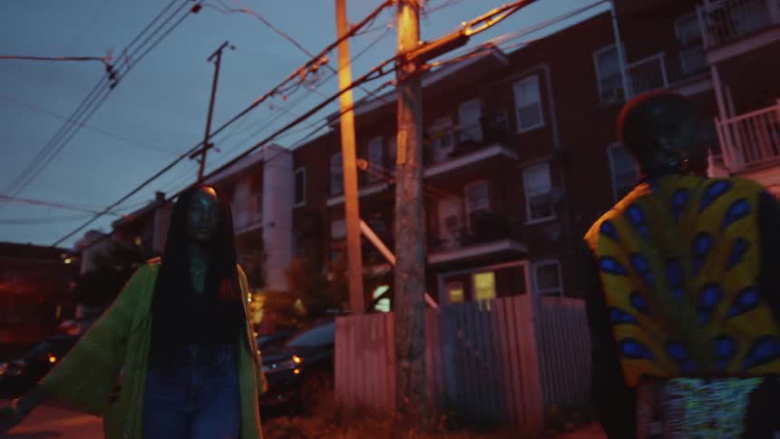 Two women dancing outdoors