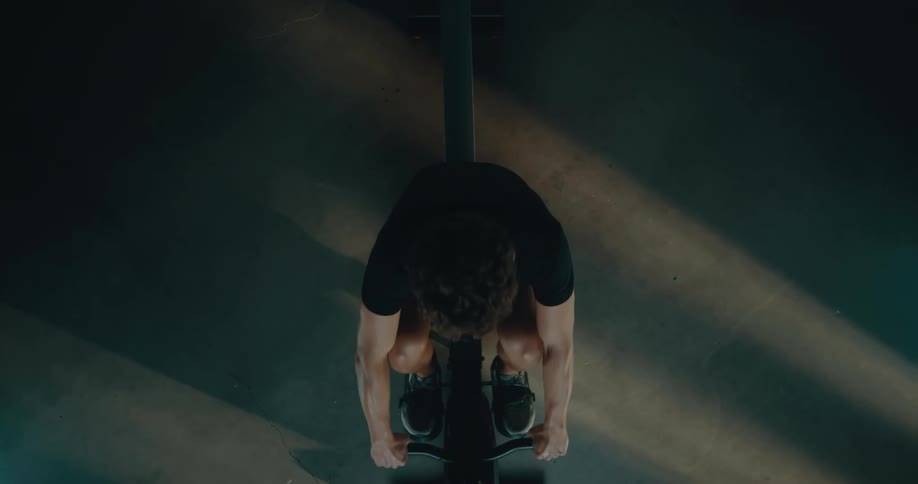 A man is working out on the exercise bike