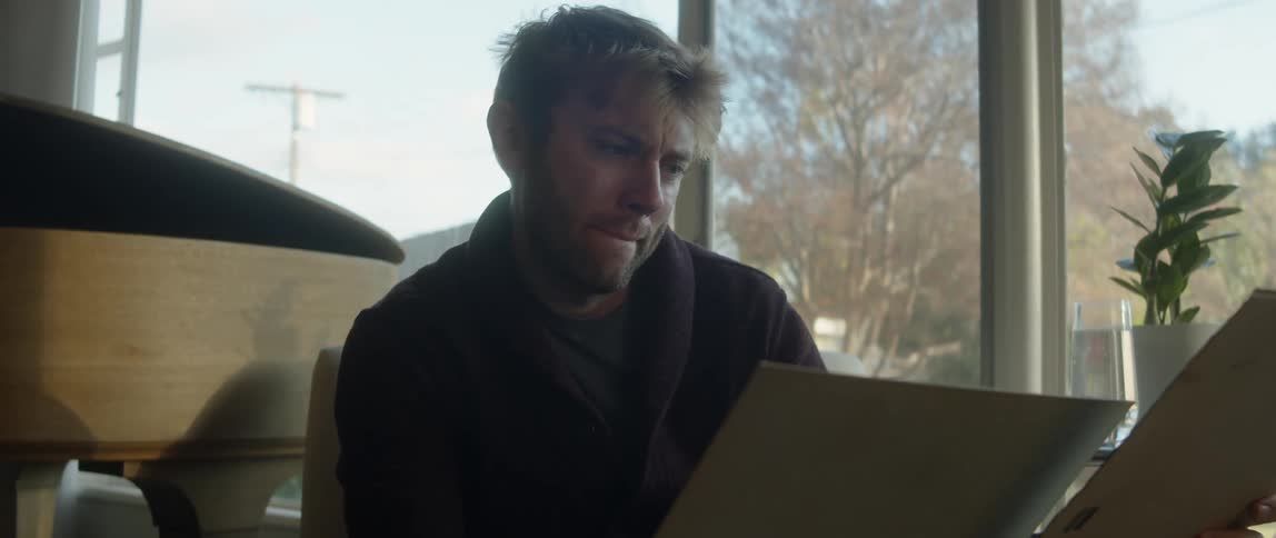 A man is looking at some papers