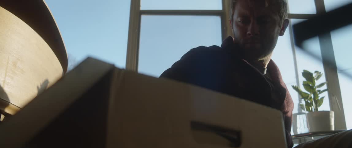A man is looking at a picture