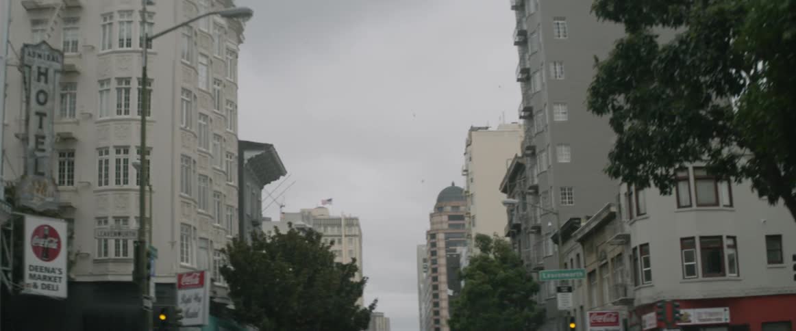 Passing by buildings on a cloudy day