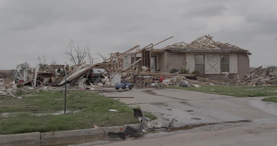 A destroyed house on a cloudy day