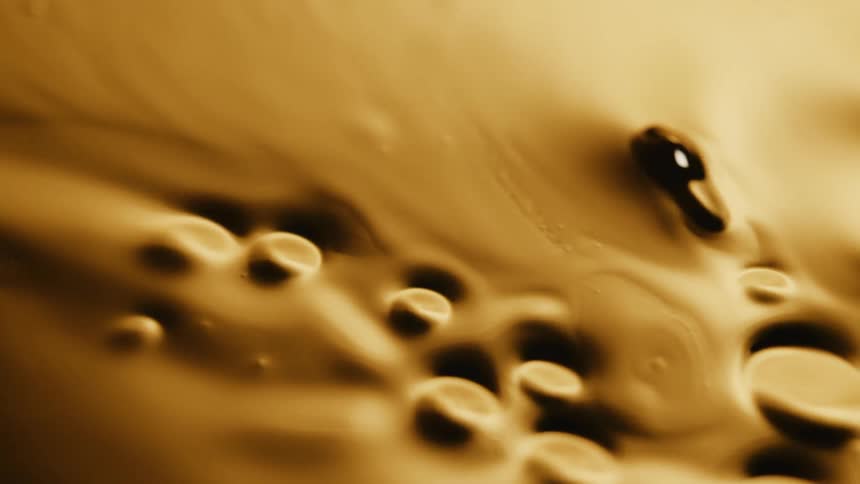 Bubbles and nuggets emerge on surface of mixture as it is swirled