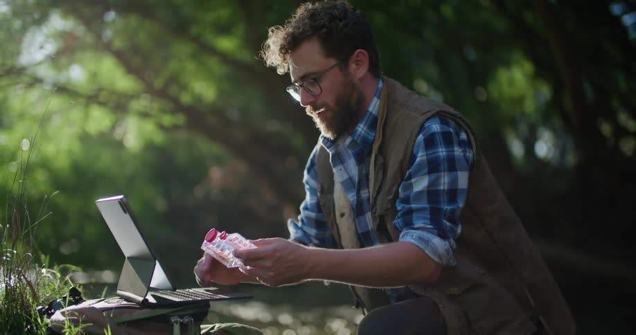 A man using a tablet outdoors