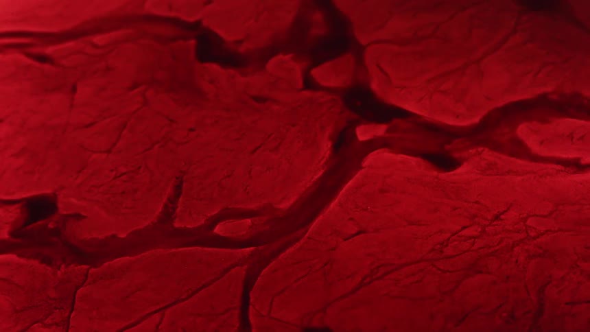 A red surface shifts and reforms