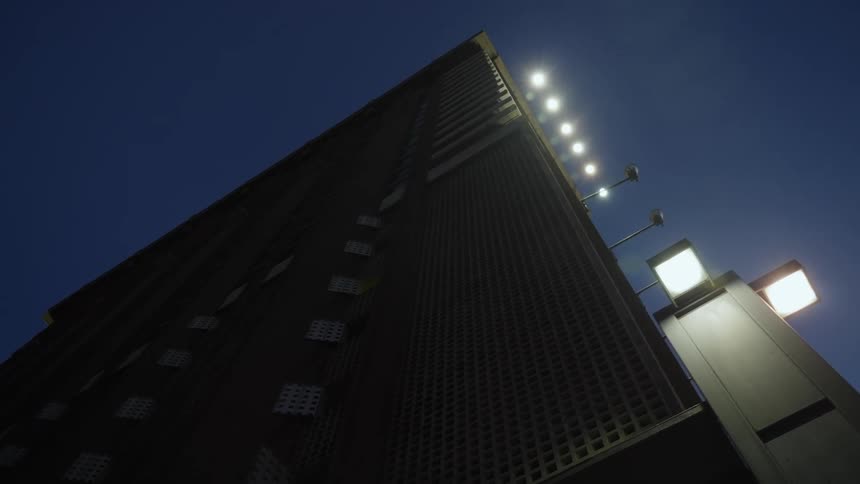 Lights glow on a tower standing tall in the night sky