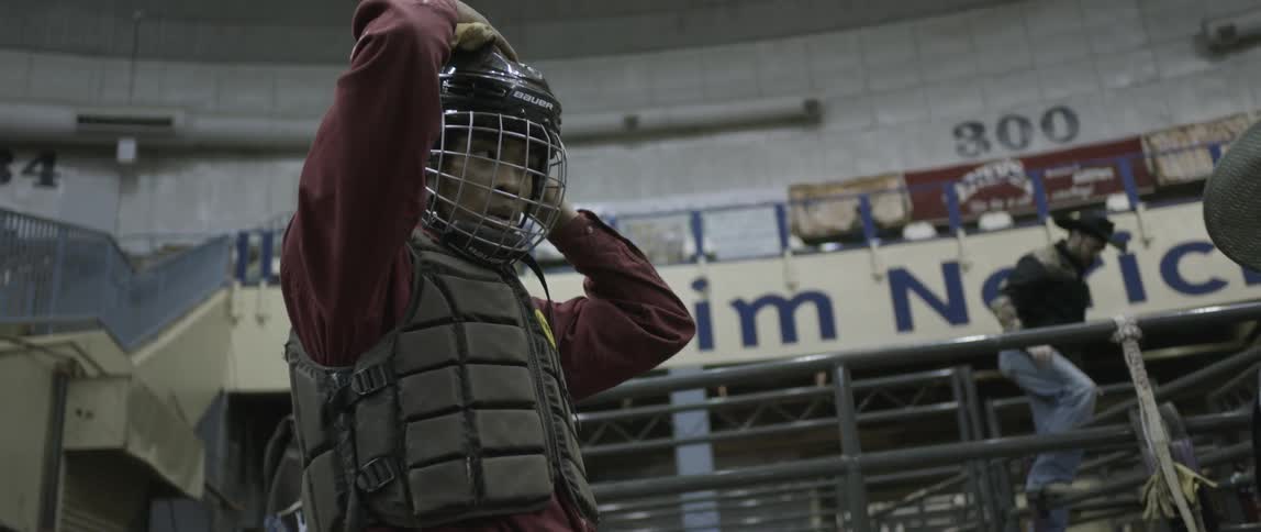 A man latches his helmet