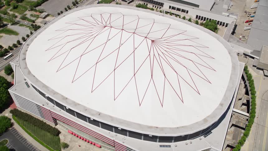 Aerial footage of the Georgia Dome in Downtown Atlanta tilting down to reveal the stadium during the day