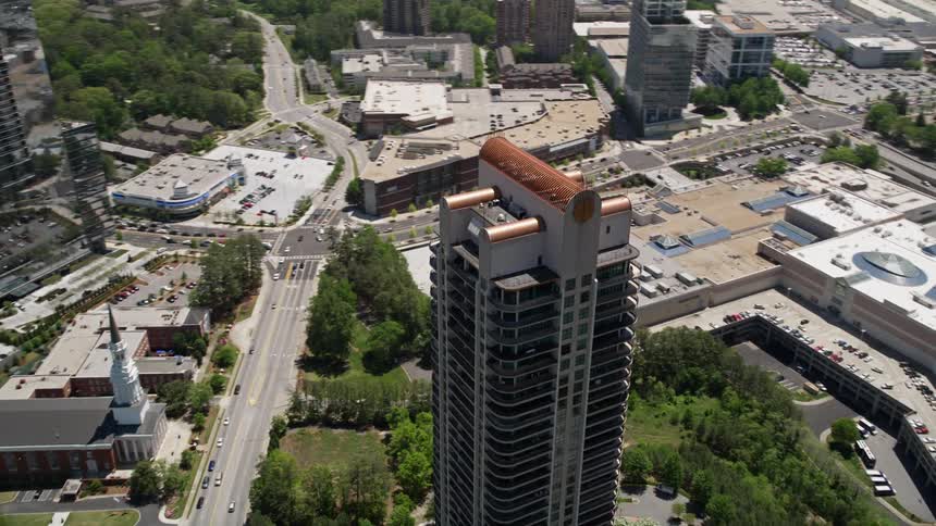 An aerial orbit of the Park Avenue Condominiums in Buckhead GA on a sunny day
