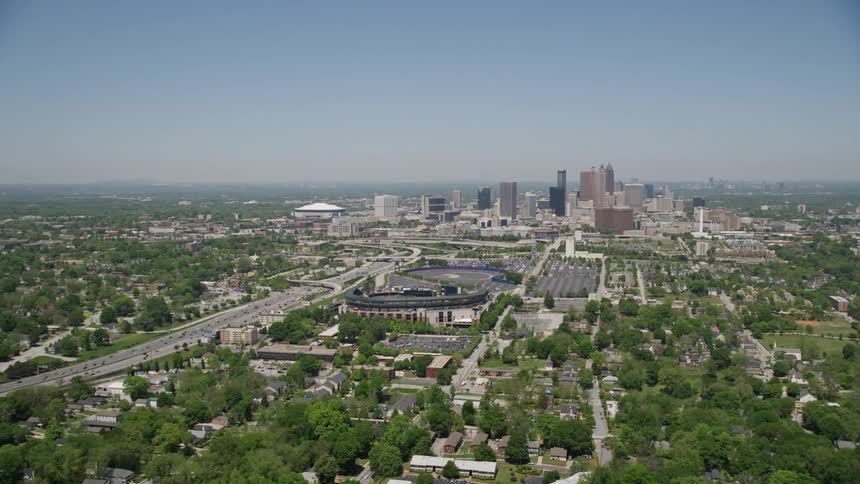 Aerial footage of Turner Field with the downtown Atlanta skyline in the background on a sunny day