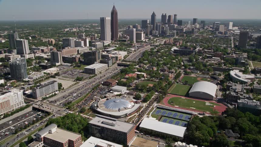 Aerial footage of Atlantas Georgia Institute of Technology Midtown and Downtown skyscrapers during a sunny day in the summer