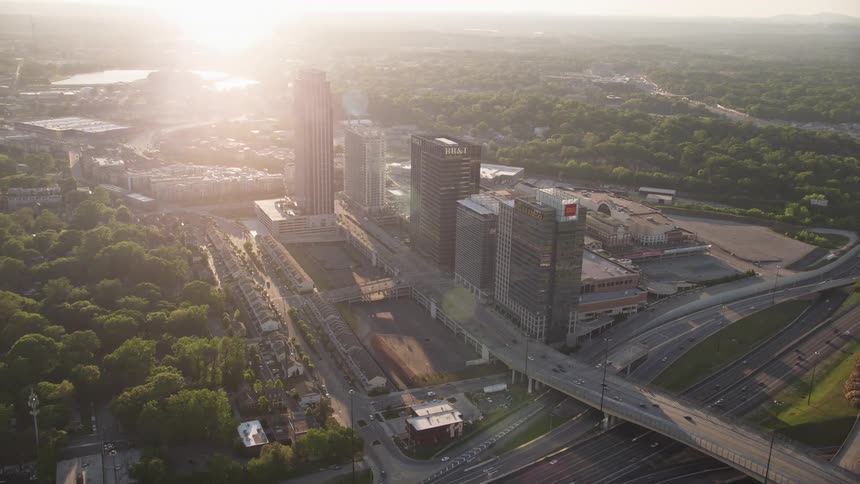 Aerial view of office buildings and The Atlantic apartments in Midtown Atlanta during sunset