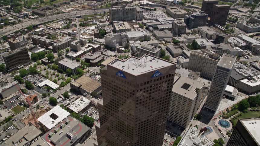 Fly over Downtown Atlantas skyscrapers and high-rise office buildings in an aerial view revealing the citys metropolis and metropolitan areas
