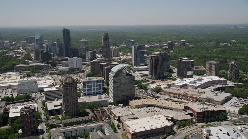 Aerial view of skyscrapers and office buildings in Buckhead Georgia under a sunny sky