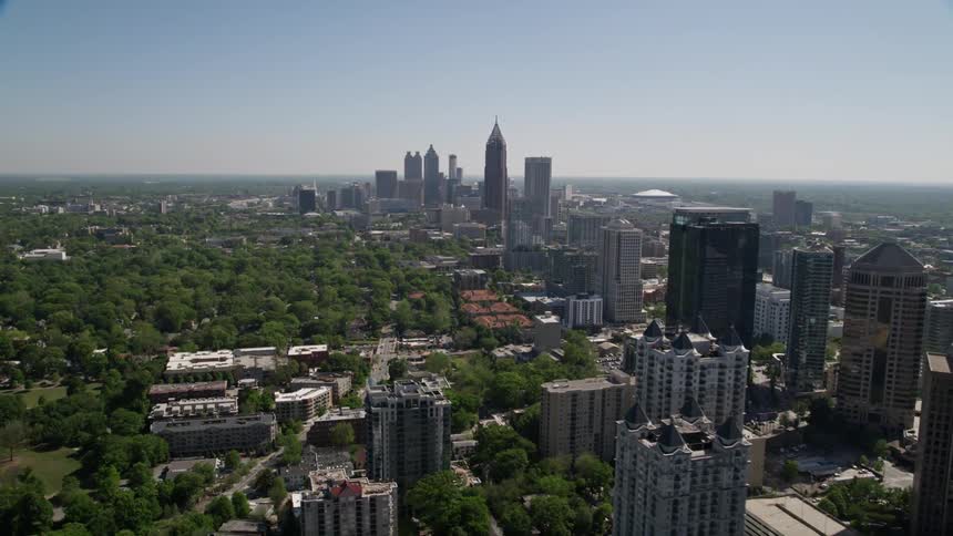 An aerial view of Downtown and Midtown Atlanta skyscrapers towering over the city during daytime in Georgia