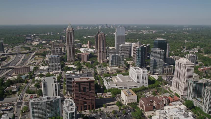 Birds eye view of Midtown Atlantas GLG Grand and Promenade II skyscrapers during a sunny day