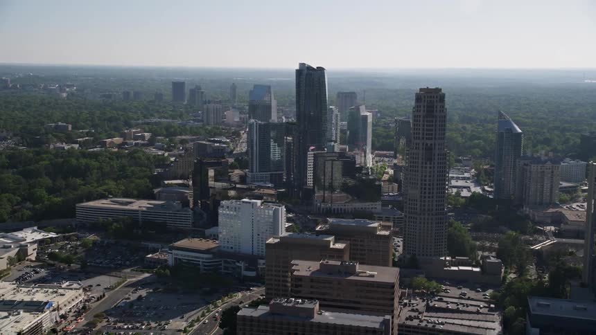 A high-quality aerial footage of the modern skyscrapers in Buckhead Georgia captured on a sunny day during summer