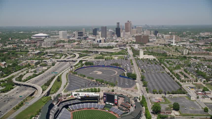 Flying over Turner Field towards Downtown Atlantas skyline in clear daytime weather