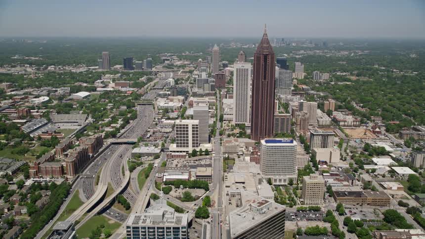 An aerial view of Atlantas bustling Midtown captures the approach to Bank of America Plaza from SunTrust Plaza