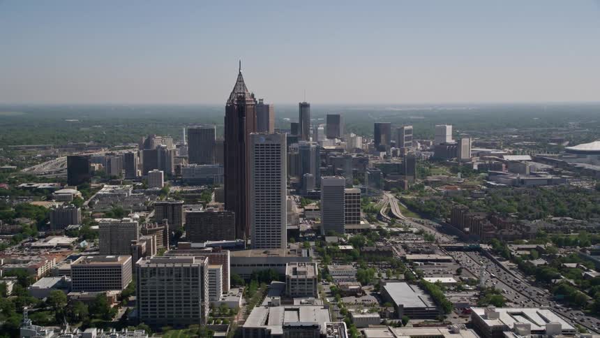Aerial view of Bank of America Plaza and AT&T Midtown center surrounded by skyscrapers in downtown Atlanta during the day