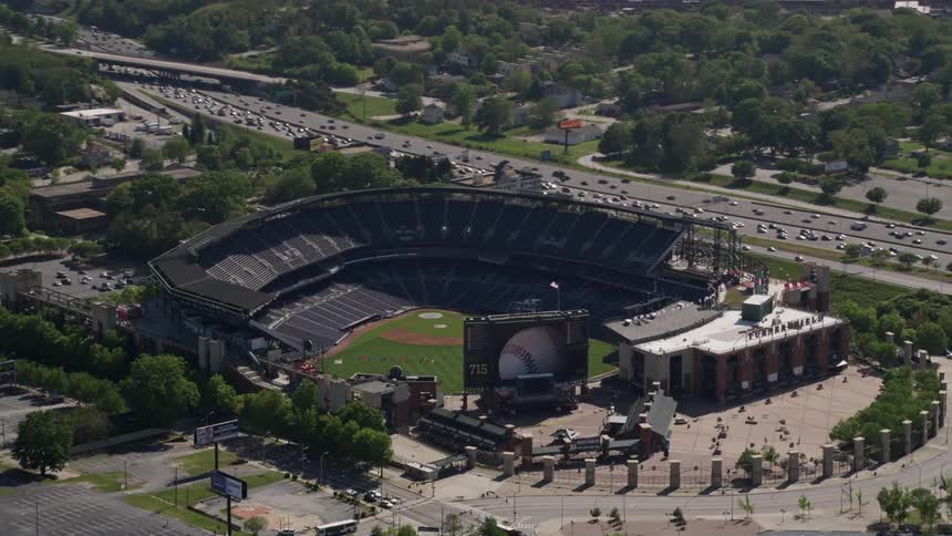 Aerial footage orbits around the empty Turner Field stadium in Atlanta Georgia during the day showcasing the surroundings