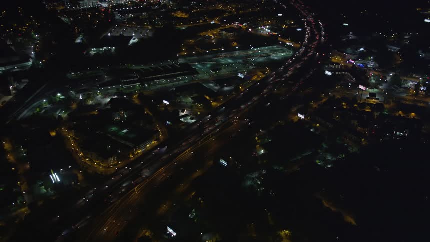 Aerial view of heavy nighttime traffic on the Northeast Expressway in Buckhead Georgia