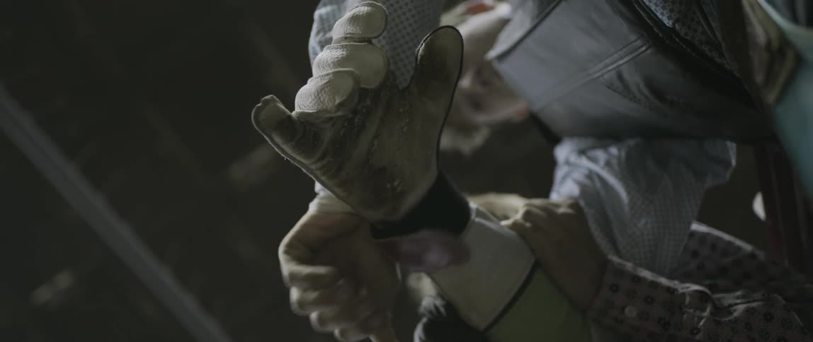A man tightens his gloves