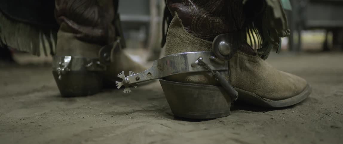 Spurs and cowboy boots at rodeo