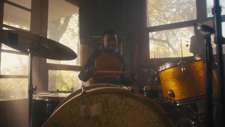 A view of a guy playing drums
