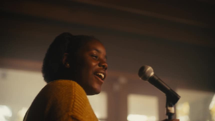A woman singing into a microphone