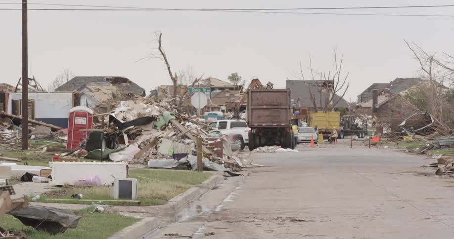 People cleaning up storm debris