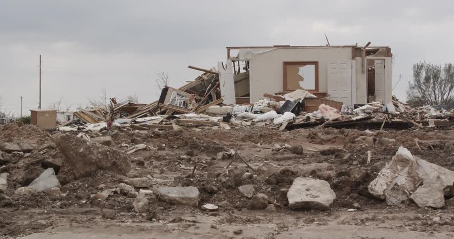A destroyed house on a cloudy day