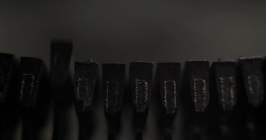 Typewriter spool is pushing letters on paper