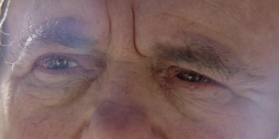 A man is looking to the side