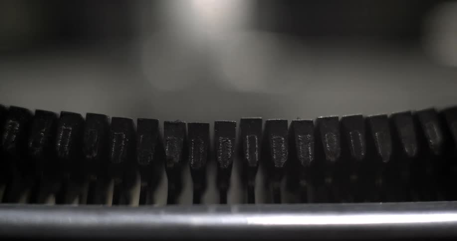Typewriter keys lifting and striking